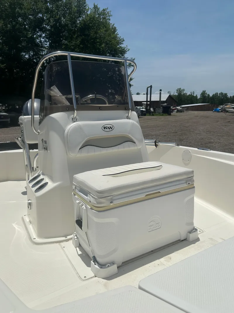 Slide: The Image of 2008 Key West 186 Bay Reef boat interior with console and cooler. - 12