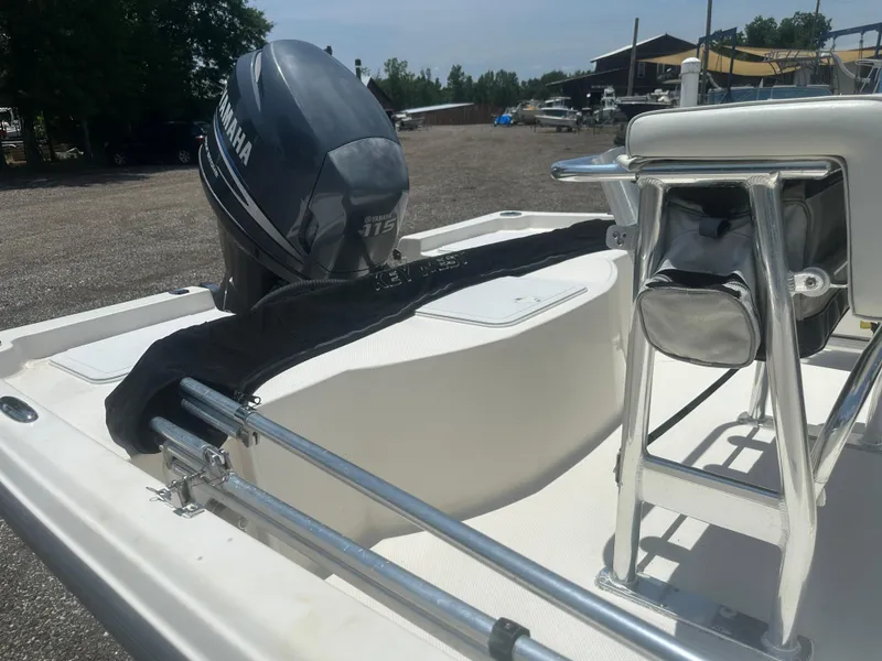 Slide: The Image of 2008 Key West 186 Bay Reef boat with Yamaha 115 engine, parked outdoors. - 14