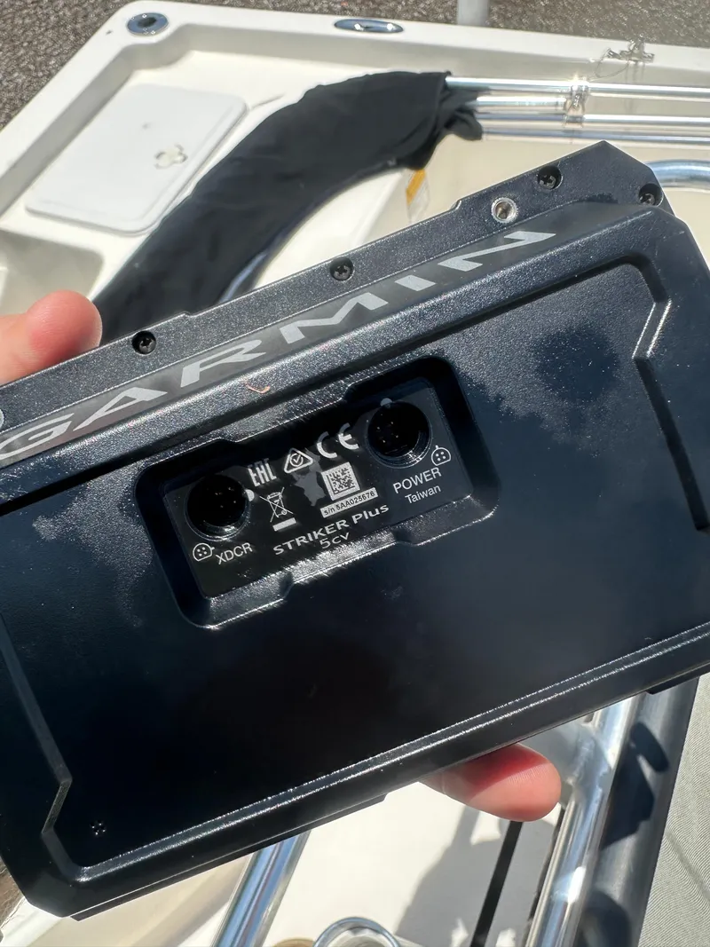 Slide: The Image of Hand holding Garmin Striker Plus 5CV device on Key West 186 Bay Reef boat, 2008 model. - 15