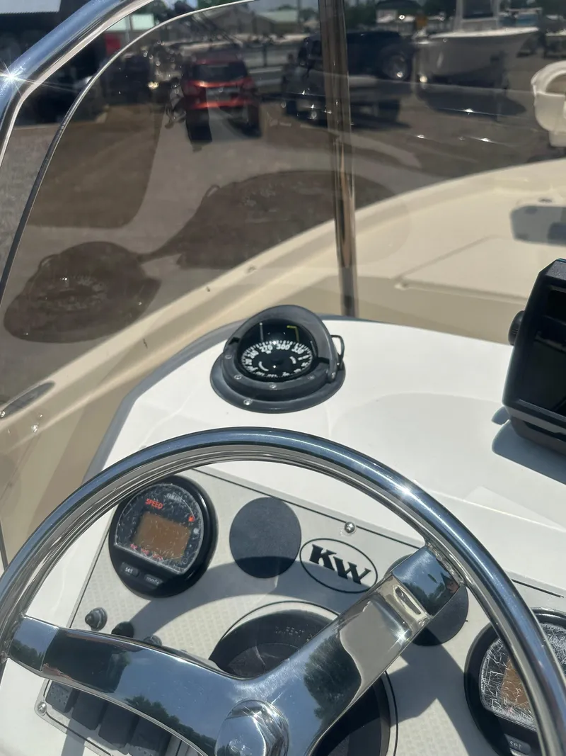 Slide: The Image of Steering console of 2008 Key West 186 Bay Reef boat with compass and gauges. - 17