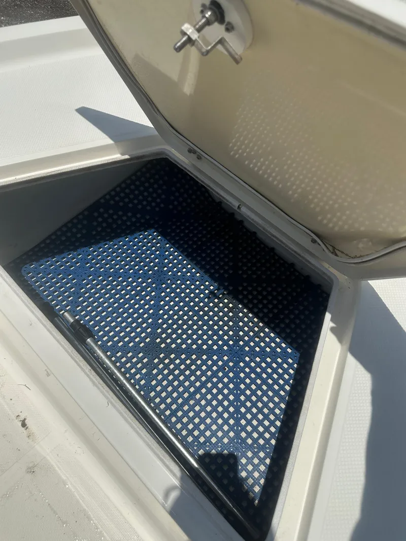 Slide: The Image of Open storage compartment on 2008 Key West 186 Bay Reef boat, featuring a blue non-slip mat. - 20
