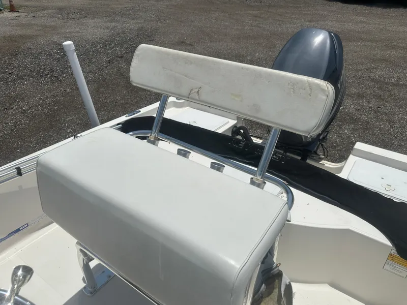 Slide: The Image of 2008 Key West 186 Bay Reef boat seat and motor, outdoor setting. - 21