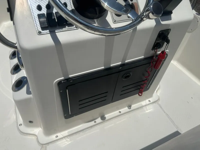 Slide: The Image of 2008 Key West 186 Bay Reef boat console with steering wheel and control panel. - 22