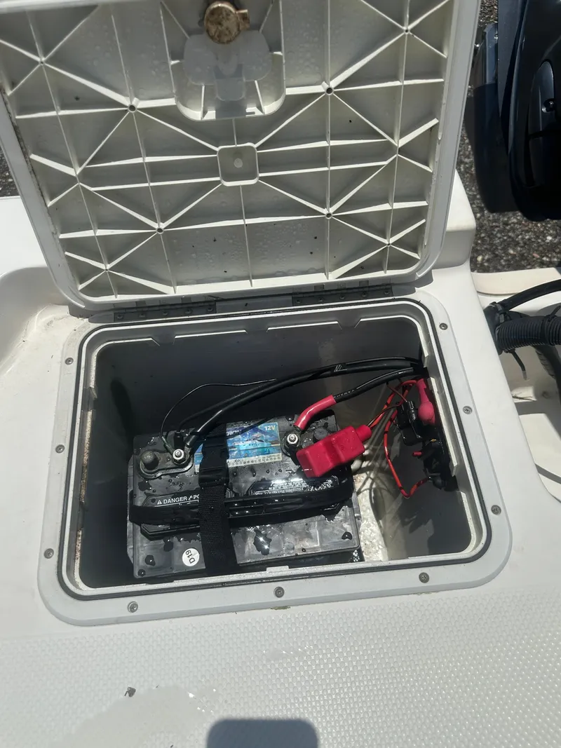 Slide: The Image of Battery compartment of a 2008 Key West 186 Bay Reef boat, open with visible wiring. - 25