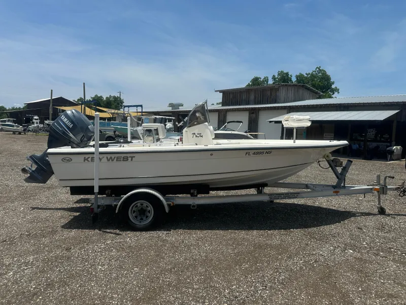 Slide: The Image of 2008 Key West 186 Bay Reef boat on trailer, parked outdoors. - 8
