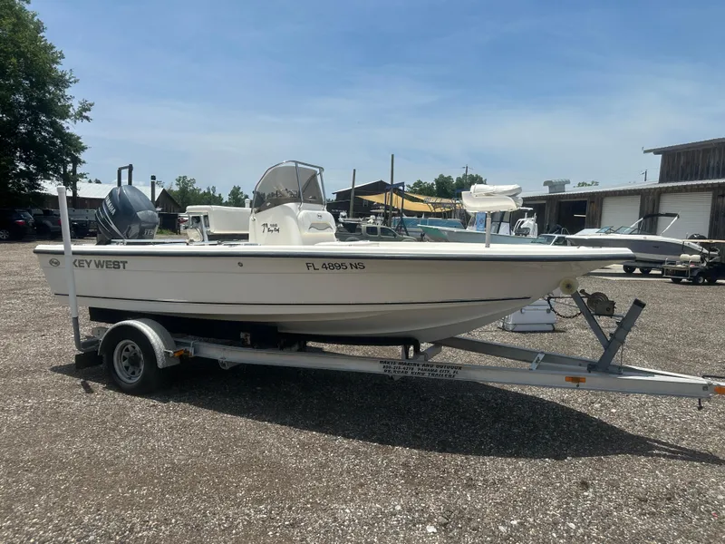 Slide: The Image of 2008 Key West 186 Bay Reef boat on trailer, parked outdoors. - 9