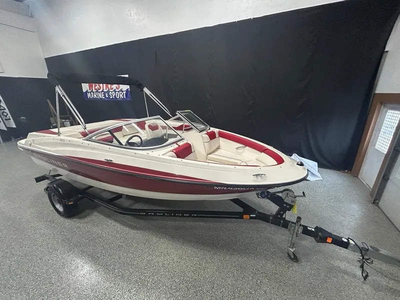 The Image of 2013 Bayliner 185 Bowrider boat on trailer in showroom. - 0