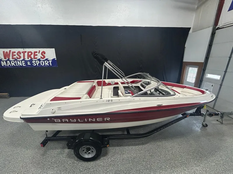 Slide: The Image of 2013 Bayliner 185 Bowrider boat on trailer at Westre's Marine & Sport showroom. - 1