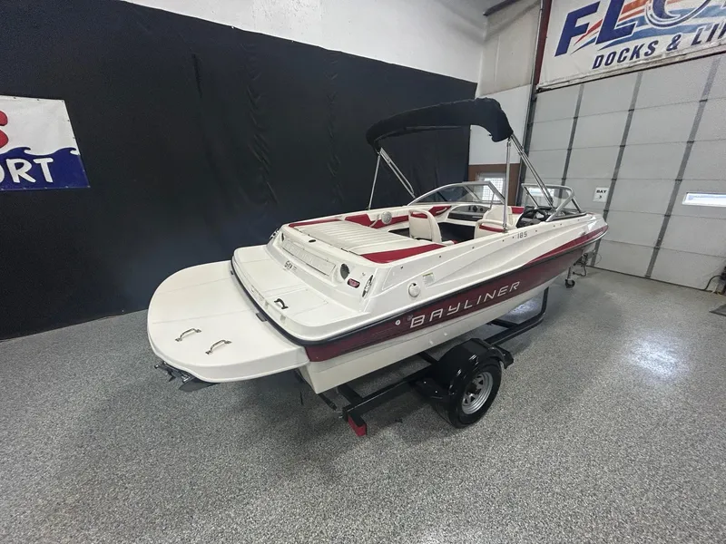 Slide: The Image of 2013 Bayliner 185 Bowrider boat on trailer in showroom. - 2
