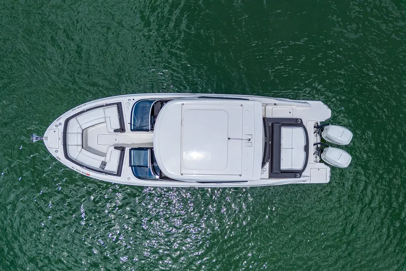 Slide: The Image of Aerial view of a 2017 Sea Ray 31 SLX boat on water. - 11