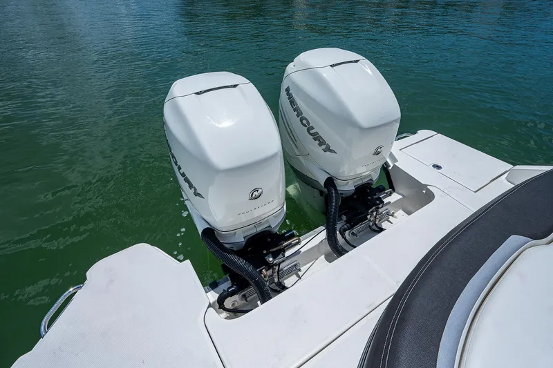 Slide: The Image of Twin Mercury outboard engines on a 2017 Sea Ray 31 SLX boat. - 12