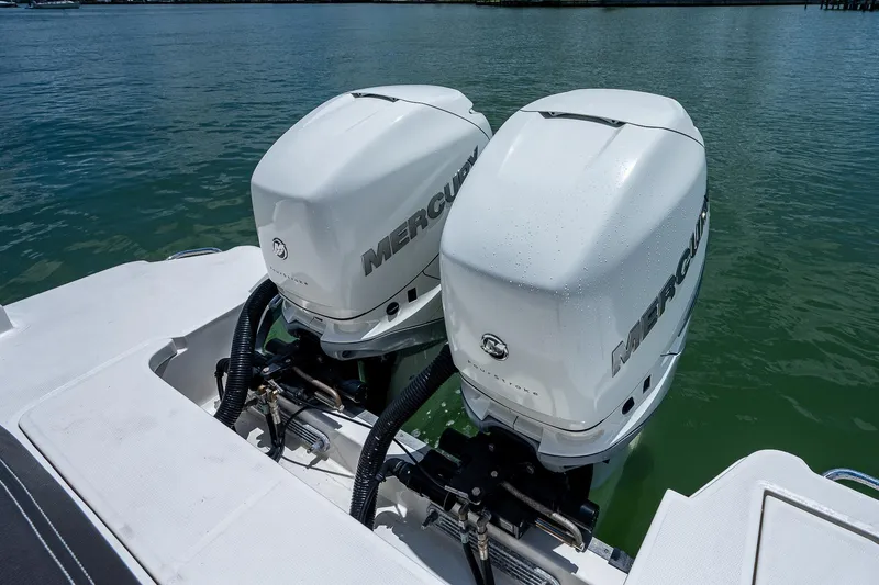 Slide: The Image of 2017 Sea Ray 31 SLX with twin Mercury outboard engines on water. - 13