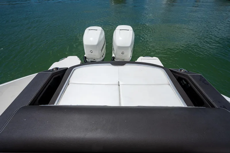 Slide: The Image of 2017 Sea Ray 31 SLX boat with twin outboard engines on water. - 14