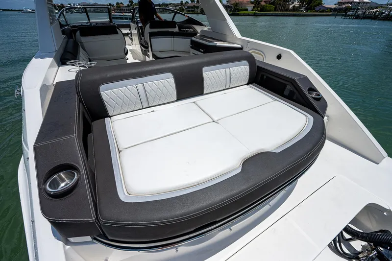 Slide: The Image of 2017 Sea Ray 31 SLX boat with spacious seating on the water. - 15