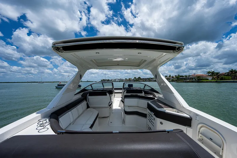 Slide: The Image of 2017 Sea Ray 31 SLX boat interior with seating, on a sunny day. - 16