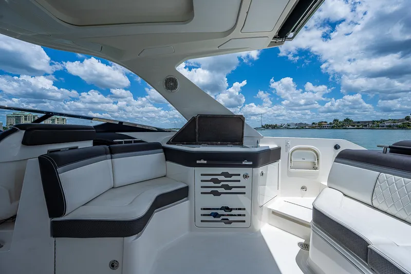 Slide: The Image of Interior of 2017 Sea Ray 31 SLX boat with luxurious seating and scenic water view. - 19