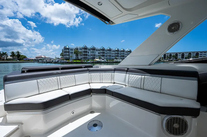 Slide: The Image of Luxurious seating area on a 2017 Sea Ray 31 SLX boat with waterfront view. - 20
