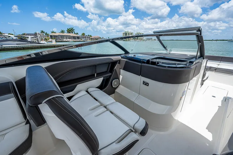 Slide: The Image of 2017 Sea Ray 31 SLX boat interior with luxurious seating and waterfront view. - 23