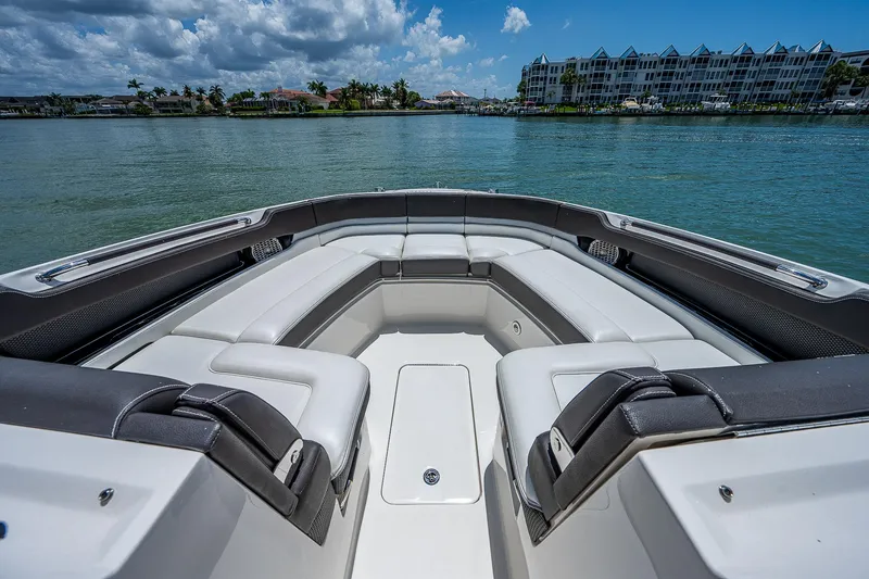 Slide: The Image of 2017 Sea Ray 31 SLX boat with spacious seating on calm water. - 29