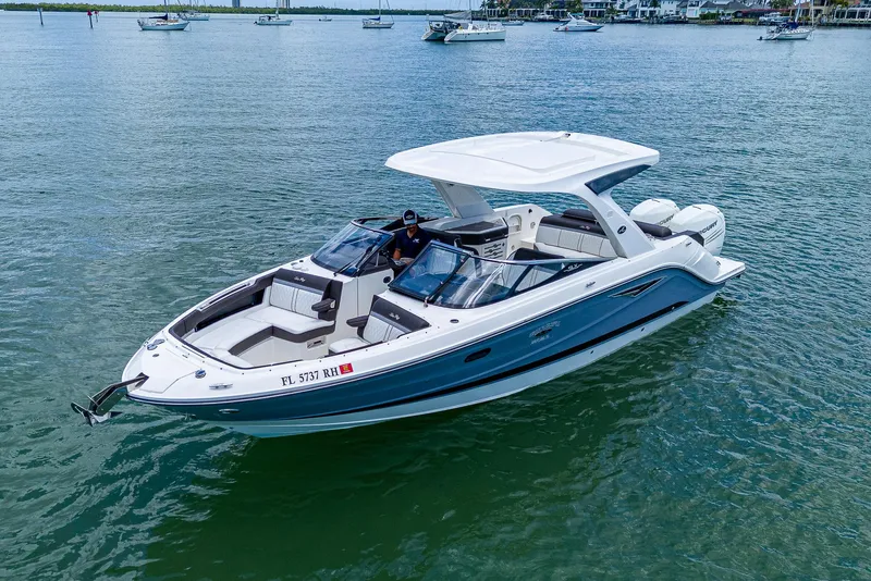Slide: The Image of 2017 Sea Ray 31 SLX boat cruising on calm waters. - 3