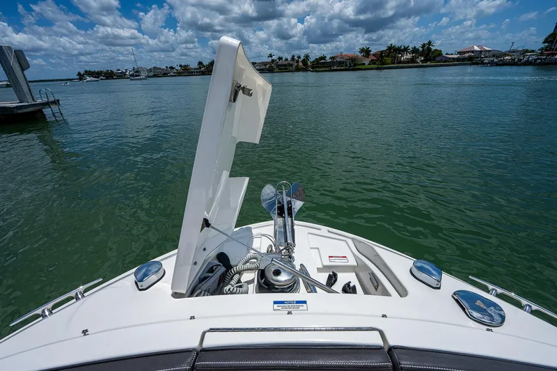 Slide: The Image of 2017 Sea Ray 31 SLX boat bow with anchor system on a sunny day. - 31