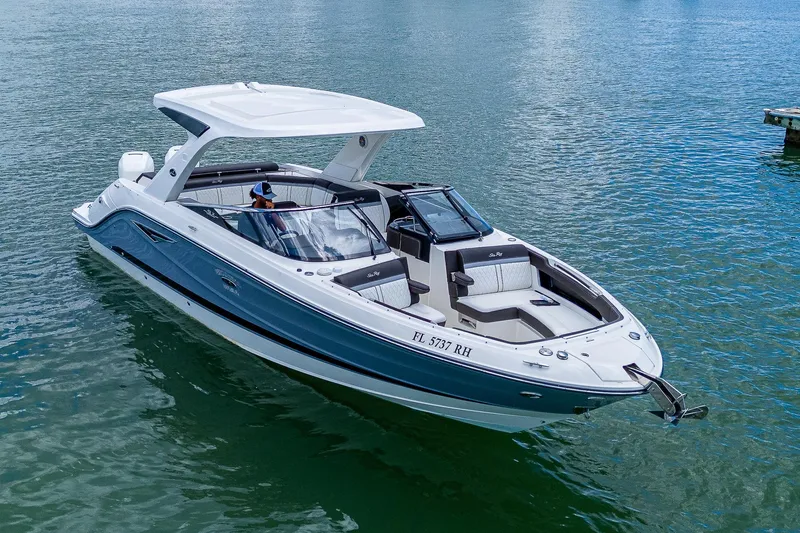 Slide: The Image of 2017 Sea Ray 31 SLX boat cruising on calm water. - 5