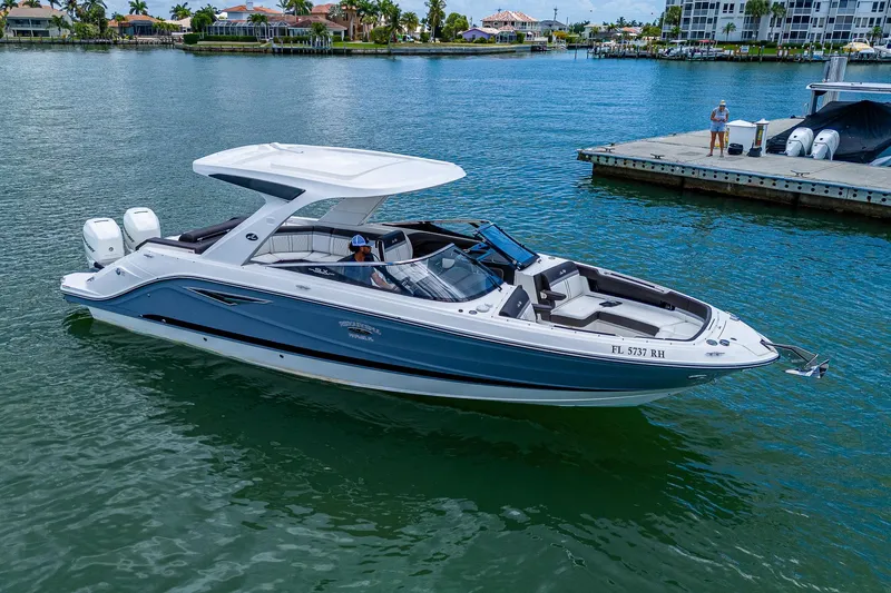 Slide: The Image of 2017 Sea Ray 31 SLX boat cruising on a calm waterway. - 6