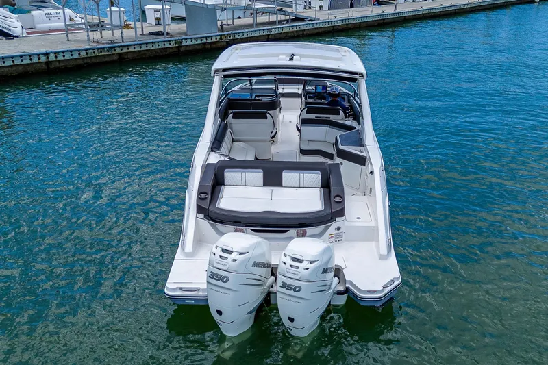 Slide: The Image of 2017 Sea Ray 31 SLX boat with twin outboard engines docked in marina. - 7