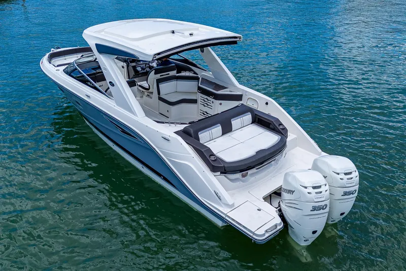 Slide: The Image of 2017 Sea Ray 31 SLX boat with twin Mercury 350 engines on water. - 8