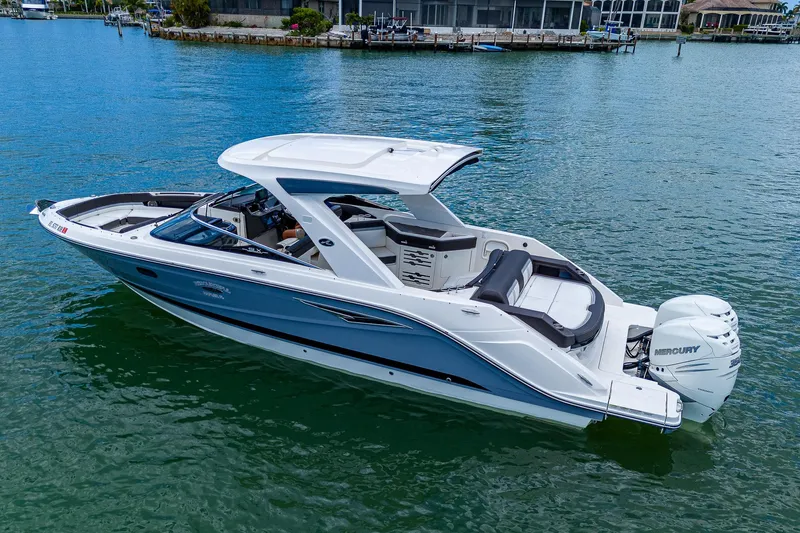 Slide: The Image of 2017 Sea Ray 31 SLX boat on calm water. - 9