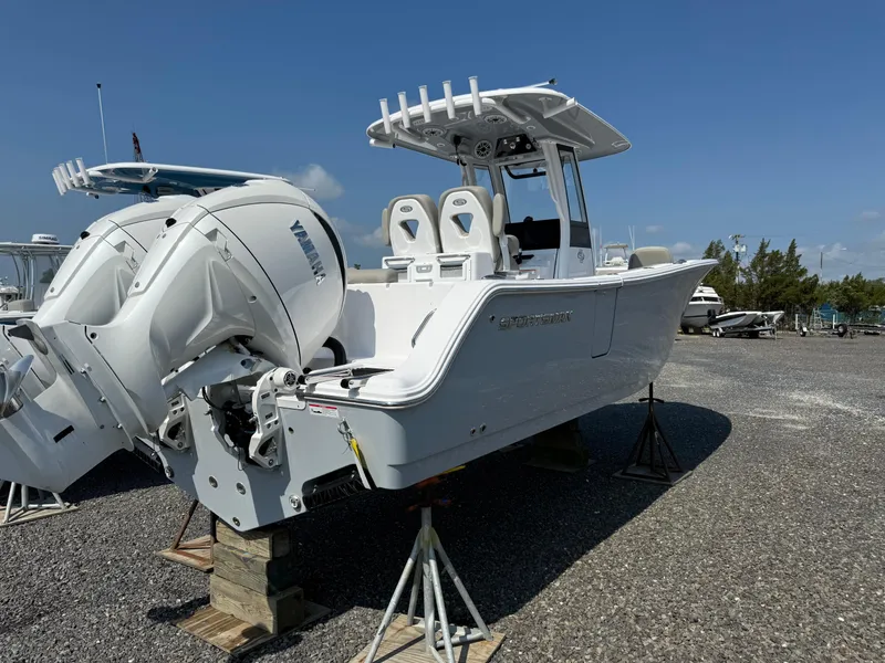Slide: The Image of 2025 Sportsman Open 262 Center Console boat with dual Yamaha engines on display. - 1