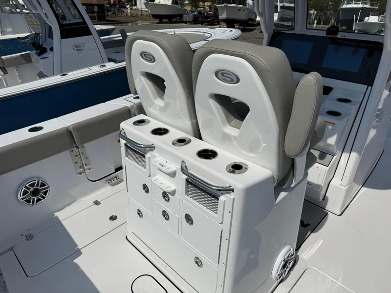 Slide: The Image of 2025 Sportsman Open 262 Center Console boat interior with dual seats and storage compartments. - 6