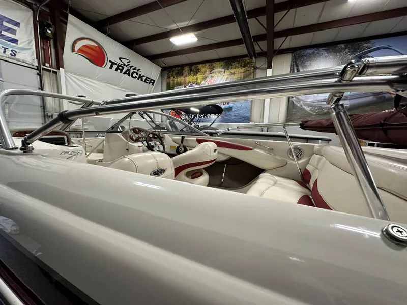 Slide: The Image of Interior of a 2014 Tahoe Q7SSI boat with steering wheel and dashboard controls. - 14