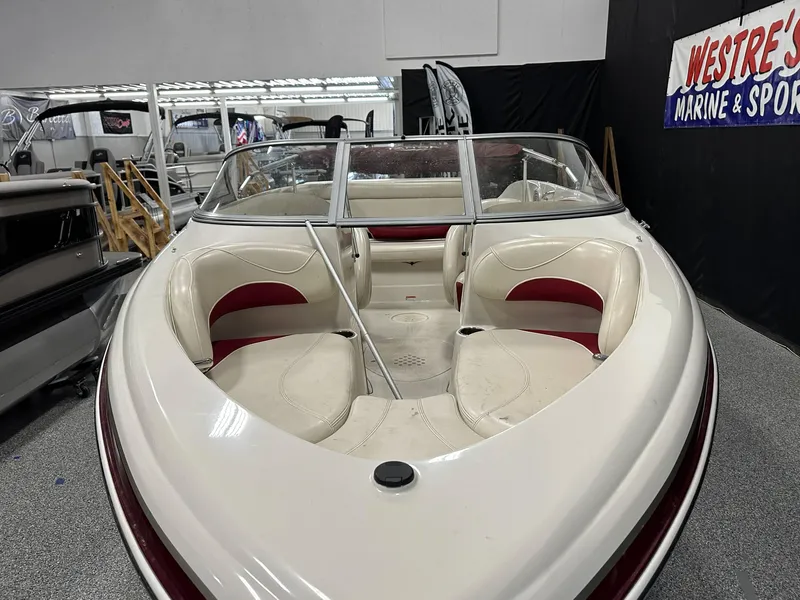 Slide: The Image of 2014 Tahoe Q7SSI boat with white and red interior at Westre's Marine & Sport showroom. - 7
