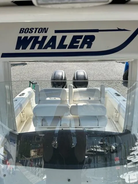 Slide: The Image of Boston Whaler 250 Outrage 2015 boat interior with dual engines and seating. - 11