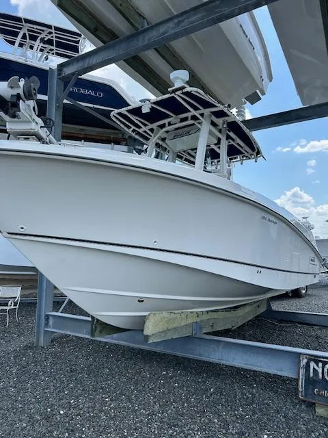 Slide: The Image of 2015 Boston Whaler 250 Outrage boat on dry dock, side view. - 3