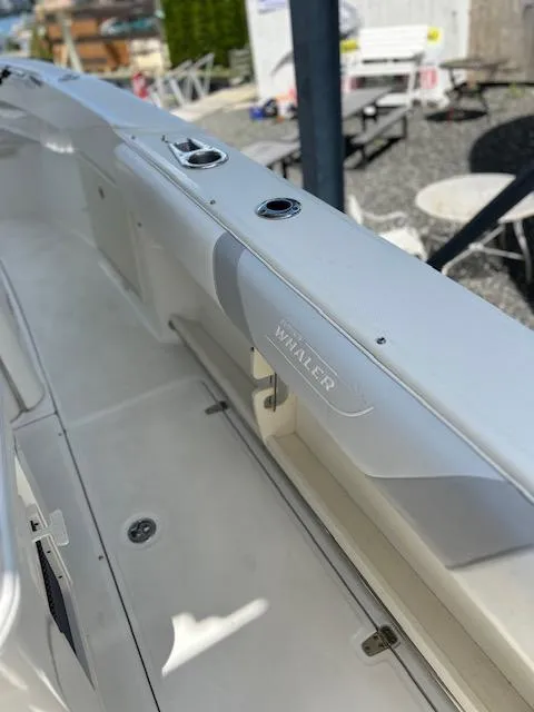 Slide: The Image of 2015 Boston Whaler 250 Outrage boat interior, showcasing sleek design and craftsmanship. - 6