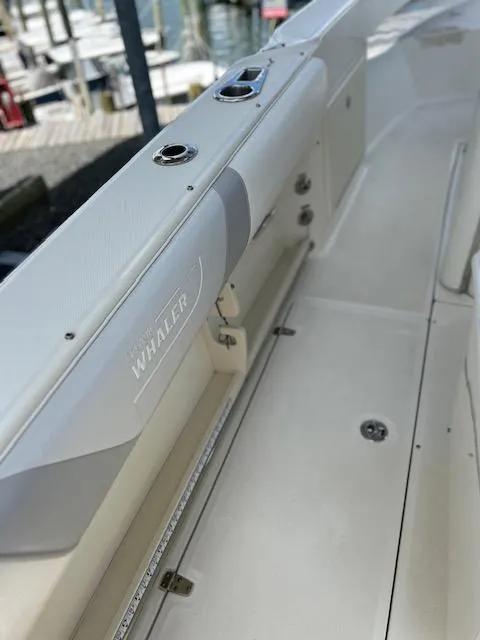 Slide: The Image of 2015 Boston Whaler 250 Outrage boat interior, featuring sleek design and modern fittings. - 7
