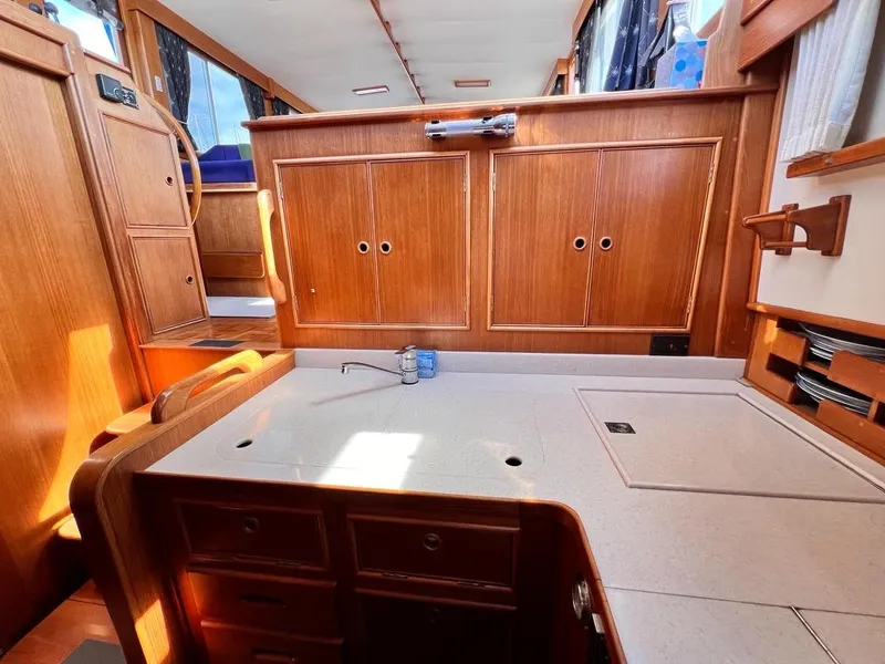 Slide: The Image of Interior of 1999 Grand Banks 42 Motoryacht with wooden cabinetry and countertop. - 16