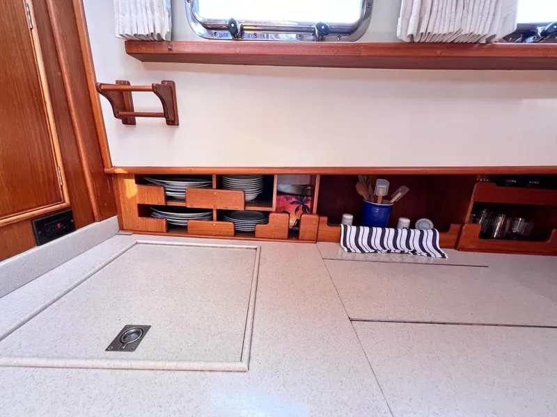 Slide: The Image of Galley interior of 1999 Grand Banks 42 Motoryacht with organized storage and countertop. - 18