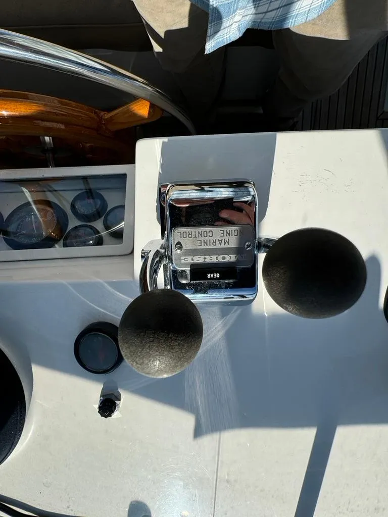 Slide: The Image of Control panel of a 1999 Grand Banks 42 Motoryacht with marine engine controls. - 29