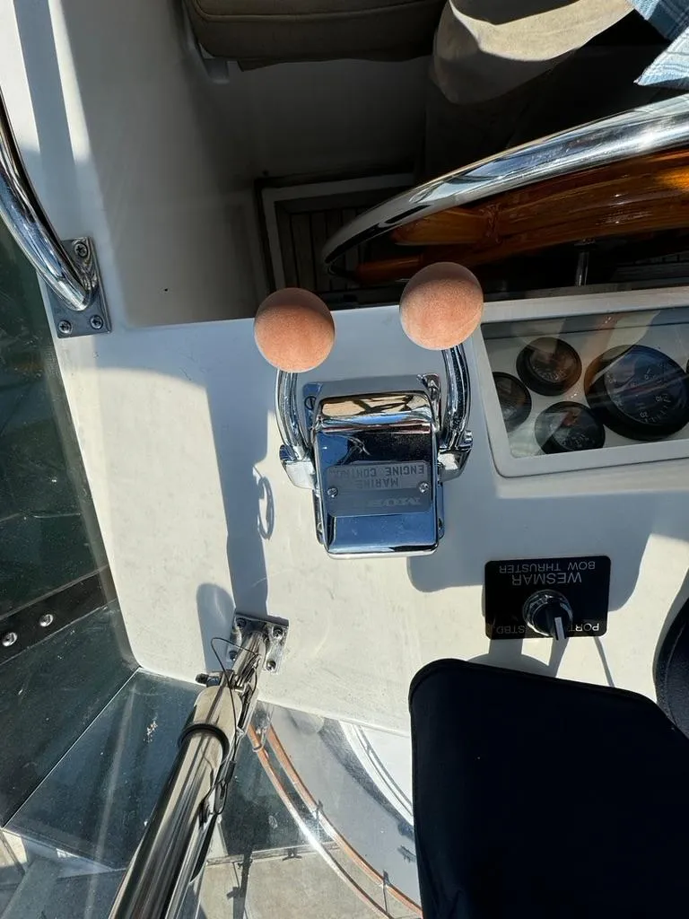 Slide: The Image of Control panel of a 1999 Grand Banks 42 Motoryacht with throttle and gauges. - 30