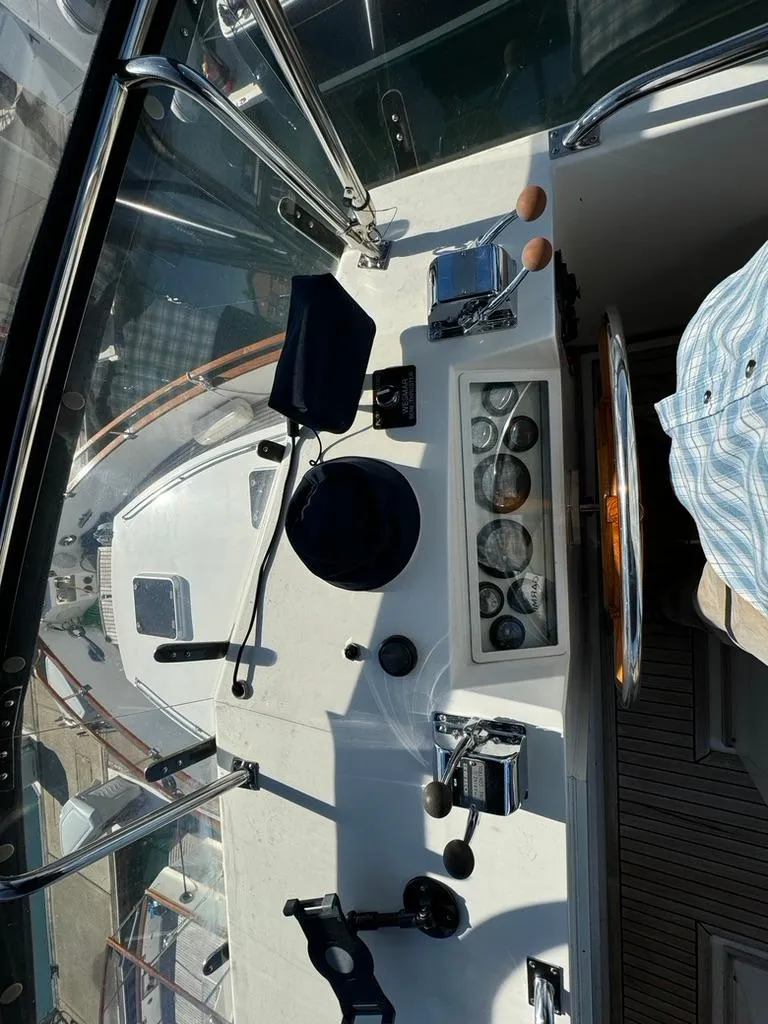 Slide: The Image of 1999 Grand Banks 42 Motoryacht helm with navigation instruments and controls. - 31