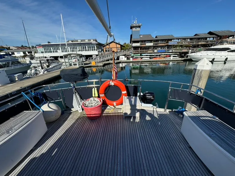 Slide: The Image of 1999 Grand Banks 42 Motoryacht docked at a marina with clear blue skies. - 38