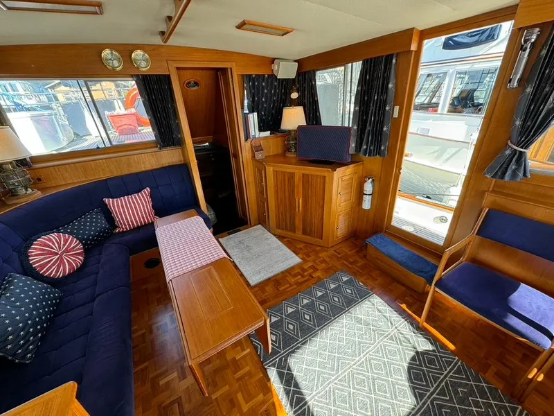 Slide: The Image of Interior of 1999 Grand Banks 42 Motoryacht with cozy seating and nautical decor. - 41