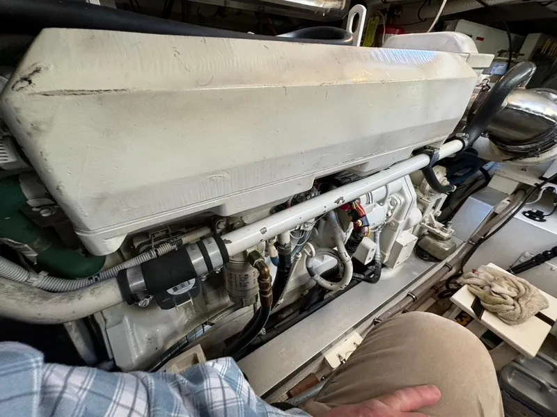 Slide: The Image of Engine room of a 1999 Grand Banks 42 Motoryacht, showcasing detailed mechanical components. - 46
