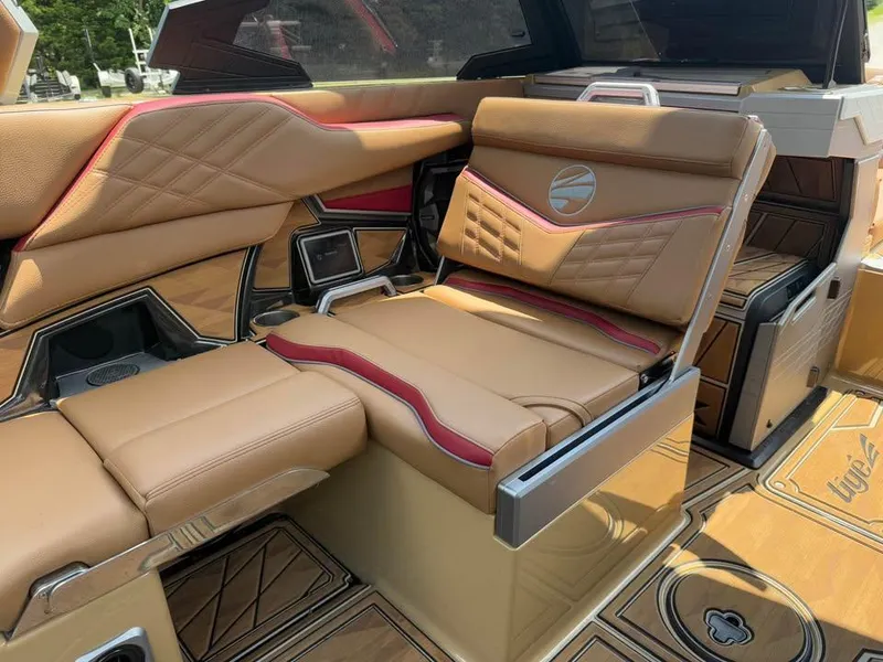 Slide: The Image of Luxurious interior of 2024 Tigé Ultré 25ZX boat with tan leather seating. - 13