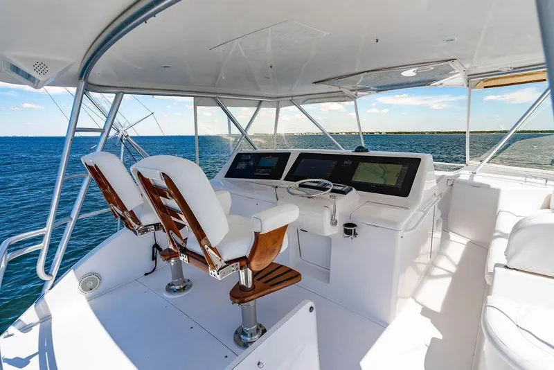 Slide: The Image of Helm of 2006 Viking 56 Convertible yacht with ocean view and modern controls. - 12