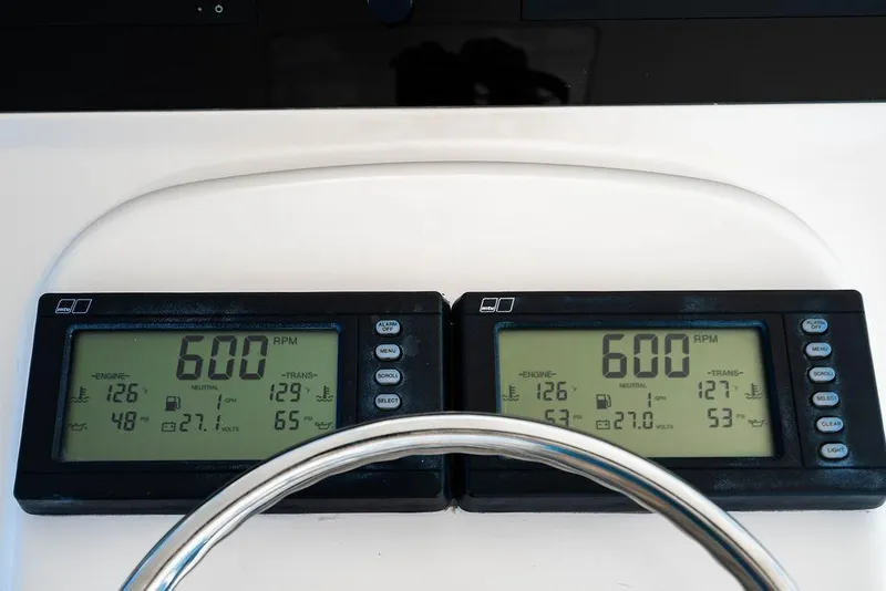 Slide: The Image of Digital engine displays on a 2006 Viking 56 Convertible yacht dashboard. - 14