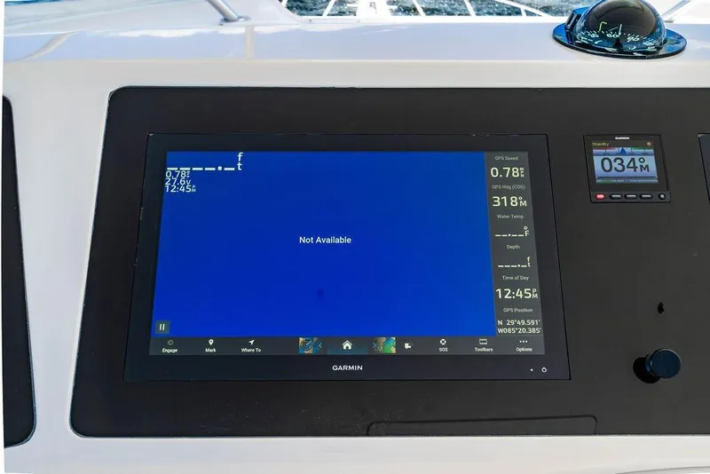 Slide: The Image of Control panel of a 2006 Viking 56 Convertible yacht with Garmin display. - 16
